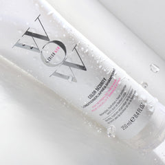 COLOR WOW conditioner being applied to thick hair to show detangling benefit