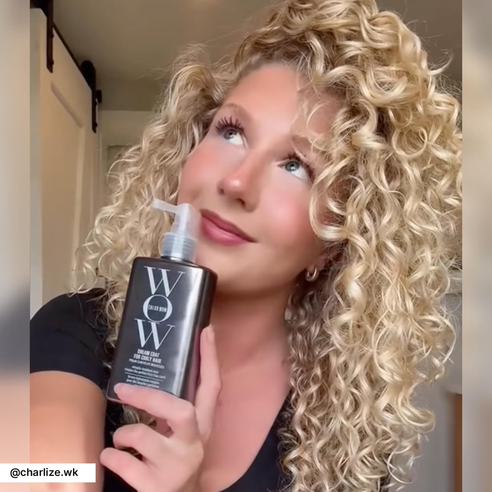 COLOR WOW model using spray outdoors for natural frizz protection