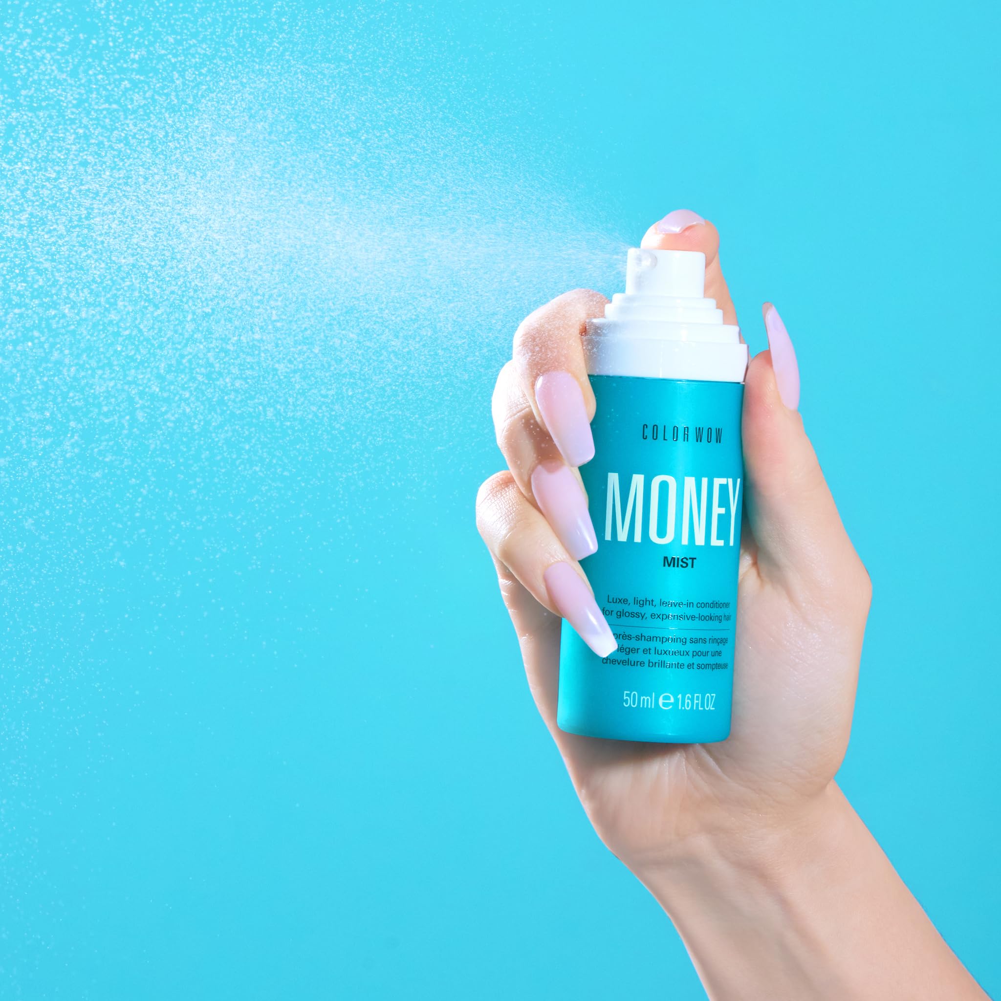 COLOR WOW Money Mist size comparison next to common bottle to show portable travel-friendly design