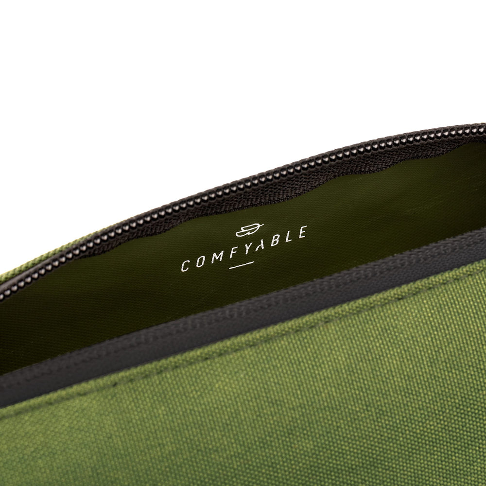 Comfyable slim mini toothbrush case green close-up, lightweight travel companion.