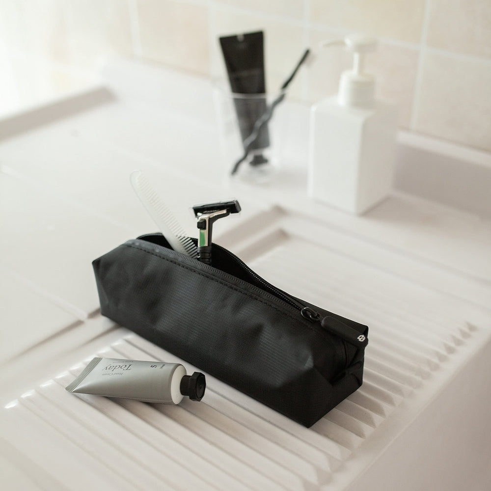 Comfyable Small Toiletry Bag organizes cables and toiletries for business trips and weekend getaways