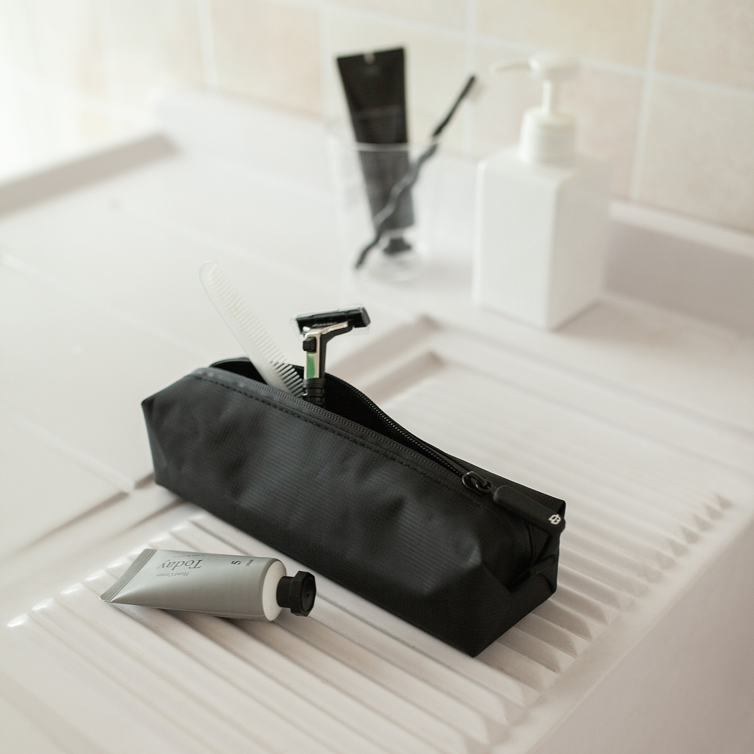 Comfyable compact organizer holds electronics and chargers for travel.