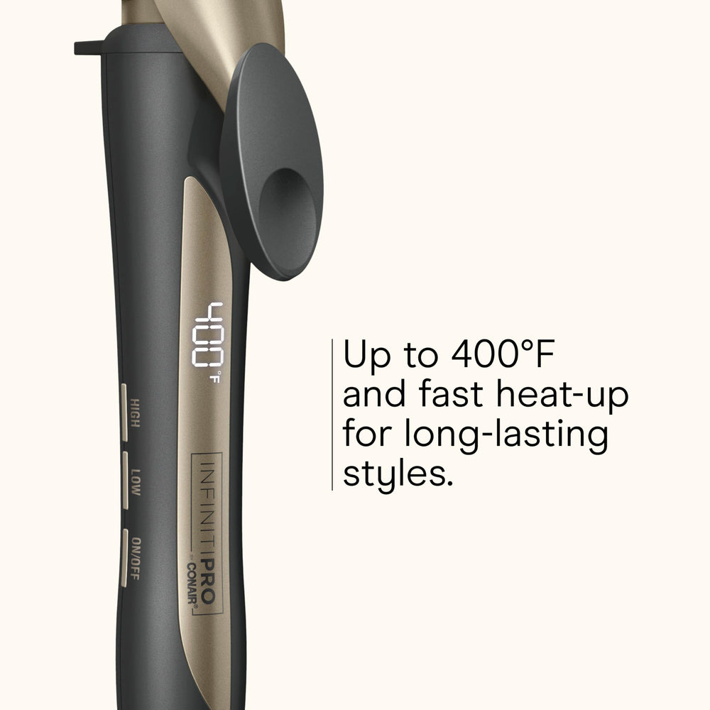 Conair Infiniti Pro clamp engages hair securely for consistent curl formation.