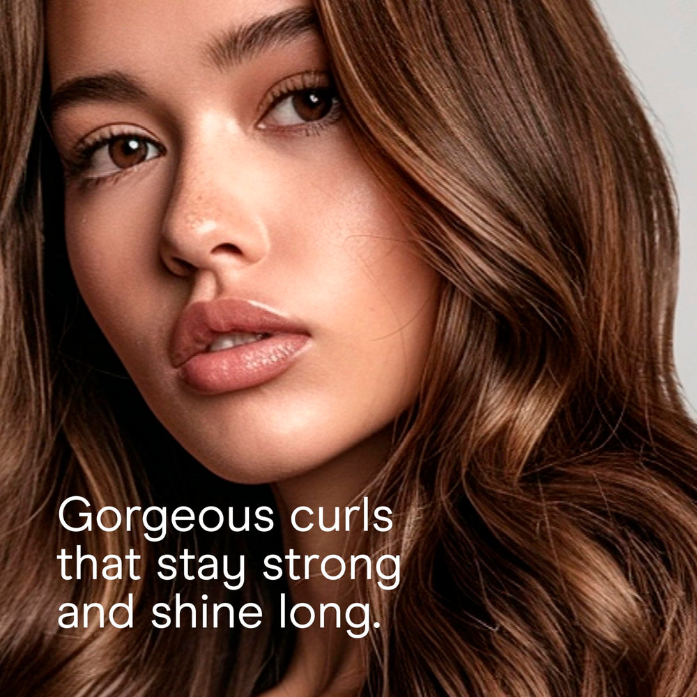 Conair Instant Heat curling iron extra-long cool tip for safer handling.