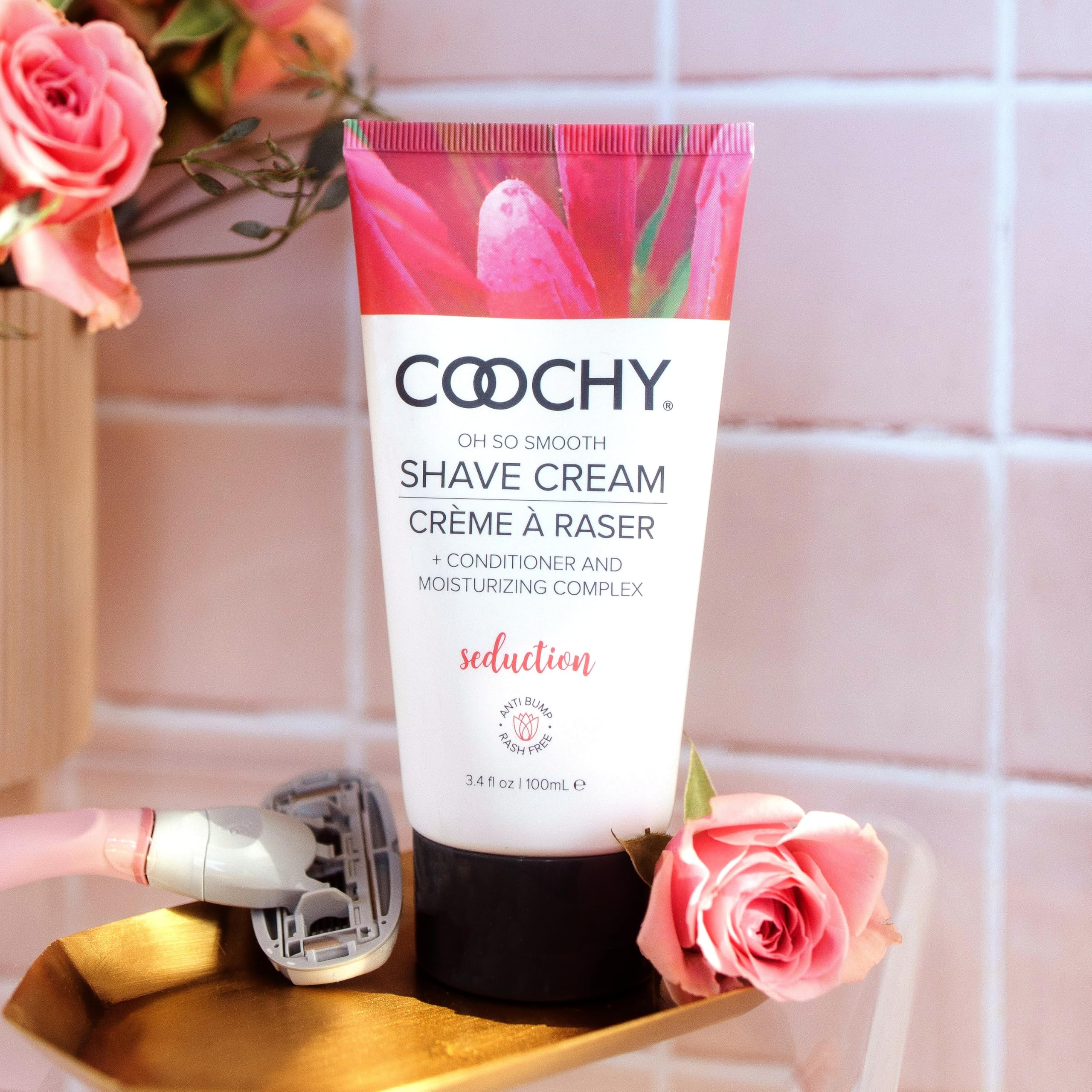 Coochy Shave Cream being applied to underarms for gentle, hydrated shaving.