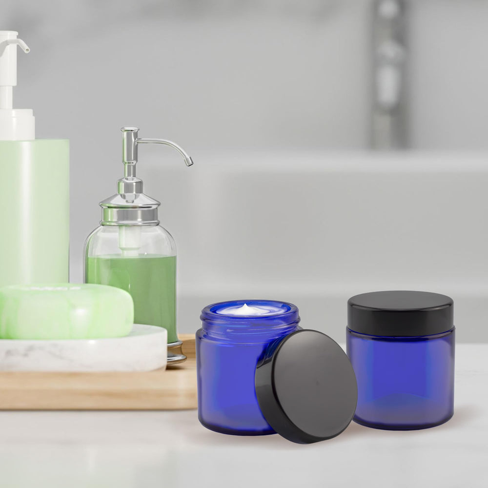 Cornucopia Brands 4oz cobalt blue glass jar, side view, BPA-free lid creates a secure seal.