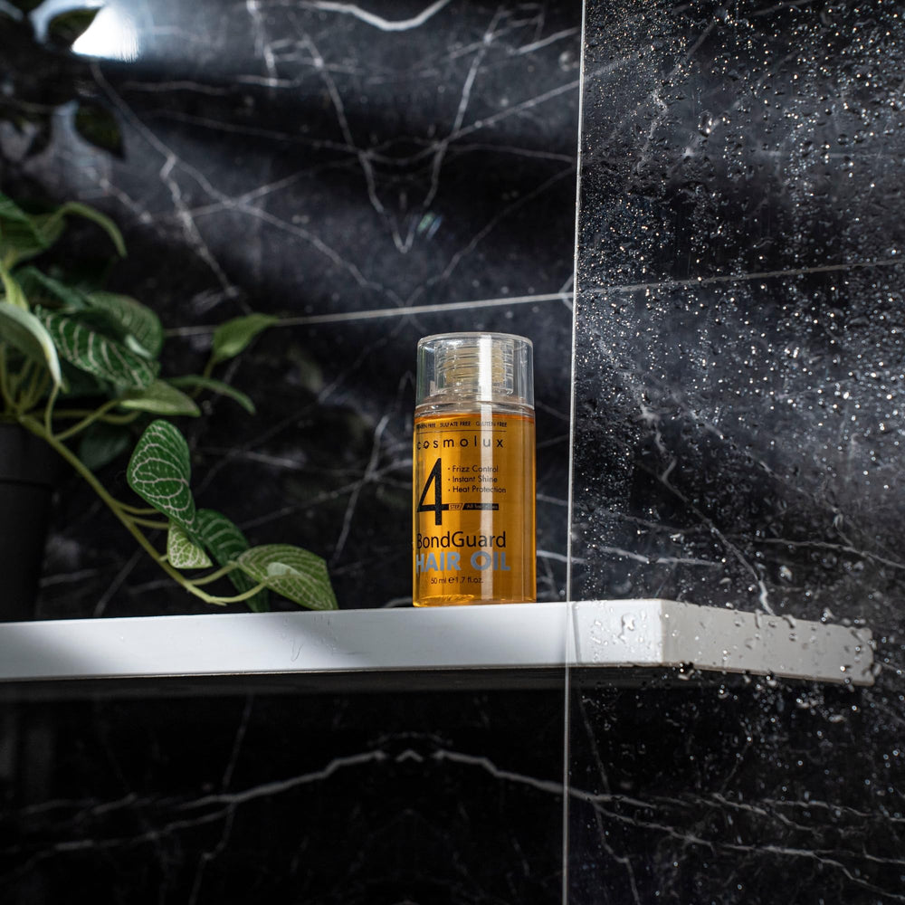 Cosmolux BondGuard application drops show lightweight, non-greasy feel before styling