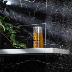 Cosmolux BondGuard application drops show lightweight, non-greasy feel before styling