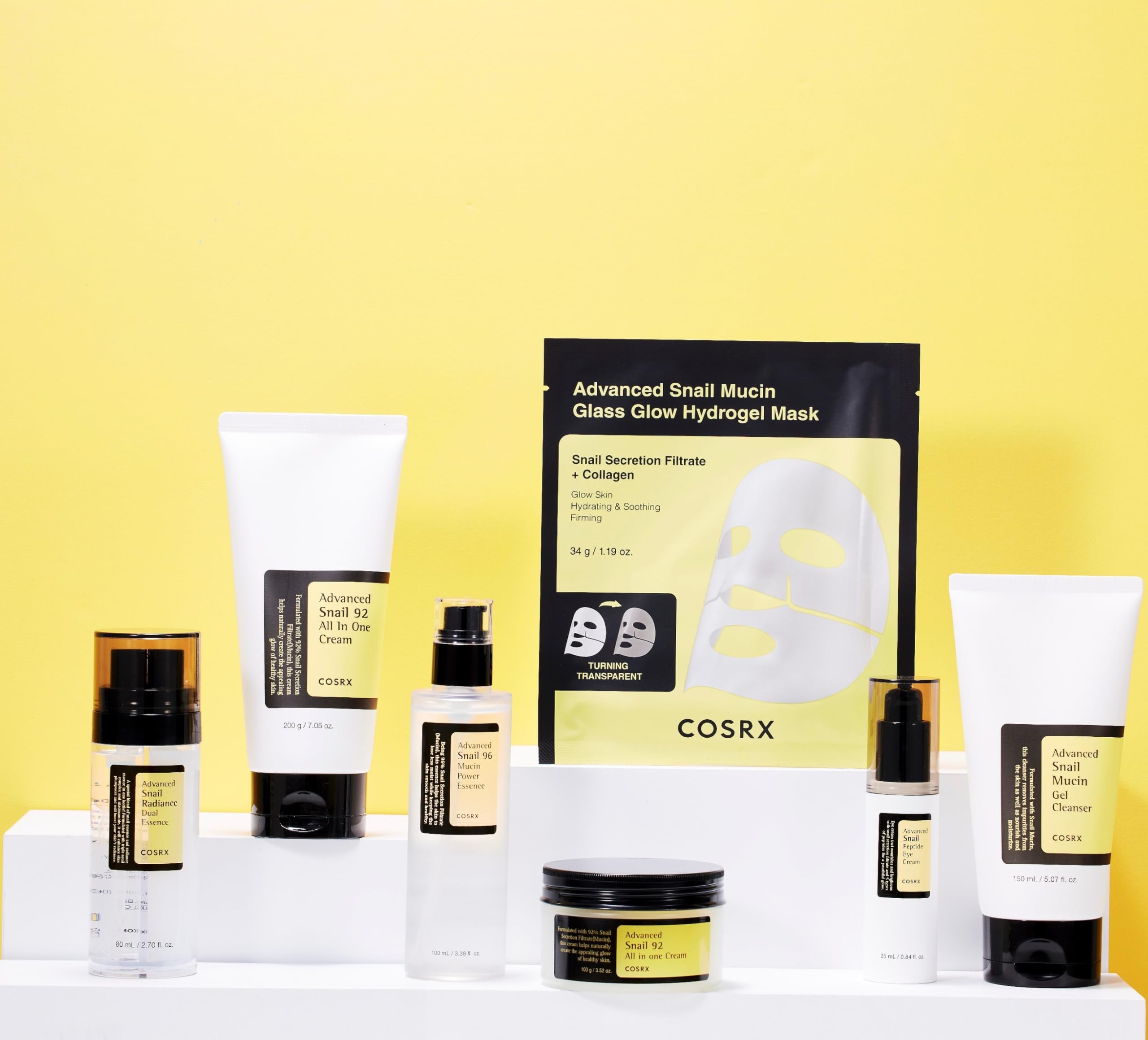 CosRX Advanced Snail Mucin Glass Glow Hydrogel Mask packaging on shelf signals soothing hydration.
