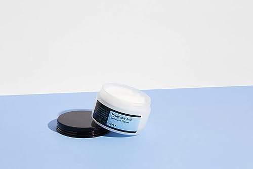 COSRX Hyaluronic Acid Moisturizing Cream texture swatch showing thick, creamy consistency.
