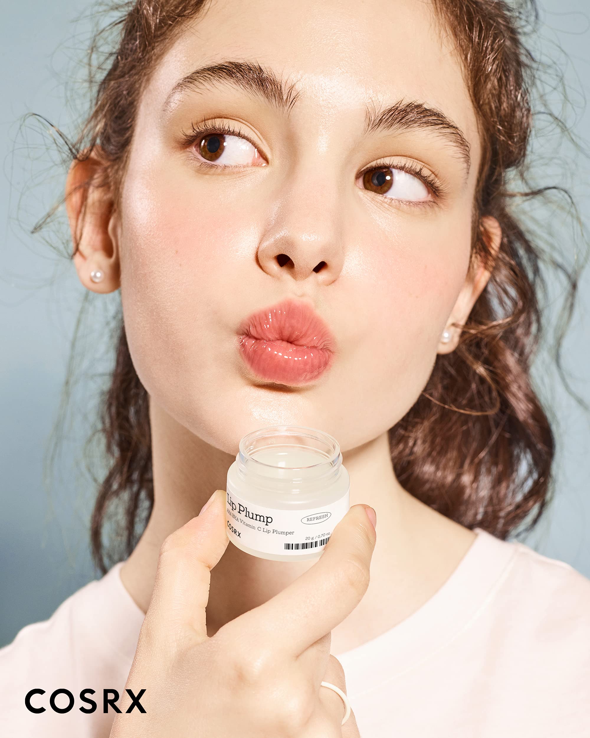 Applying COSRX Lip Care Balm for smooth, non-sticky hydration.