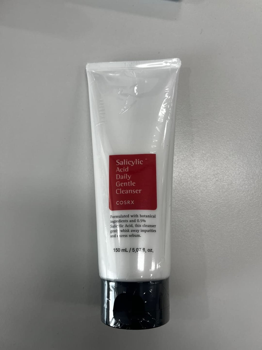 COSRX cleanser being applied to damp skin in routine