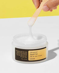 COSRX Snail Mucin 92% hand swatch demonstrating fast-absorbing moisture.