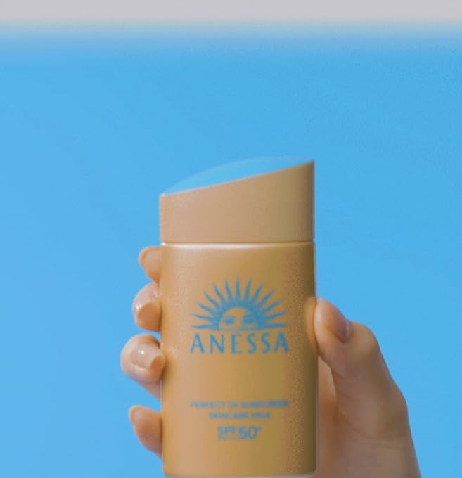 cotton-labo ANESSA sunscreen milk daily-use scene emphasizes gentle protection for sensitive skin.