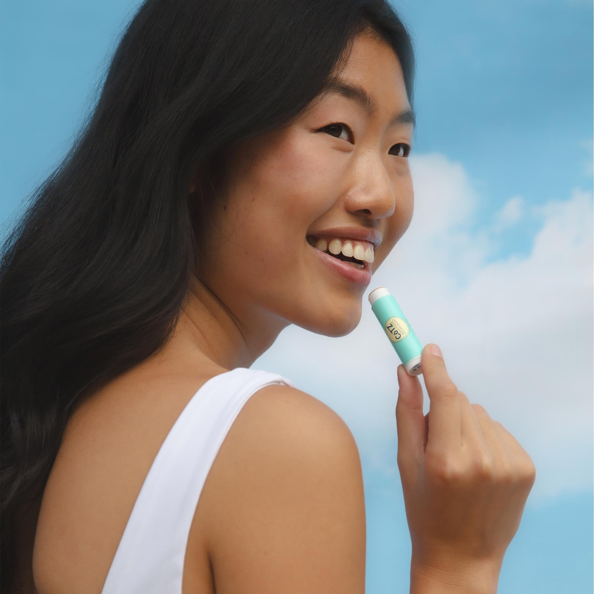 CoTZ Lip SPF 45 on lips during sunny outdoor use