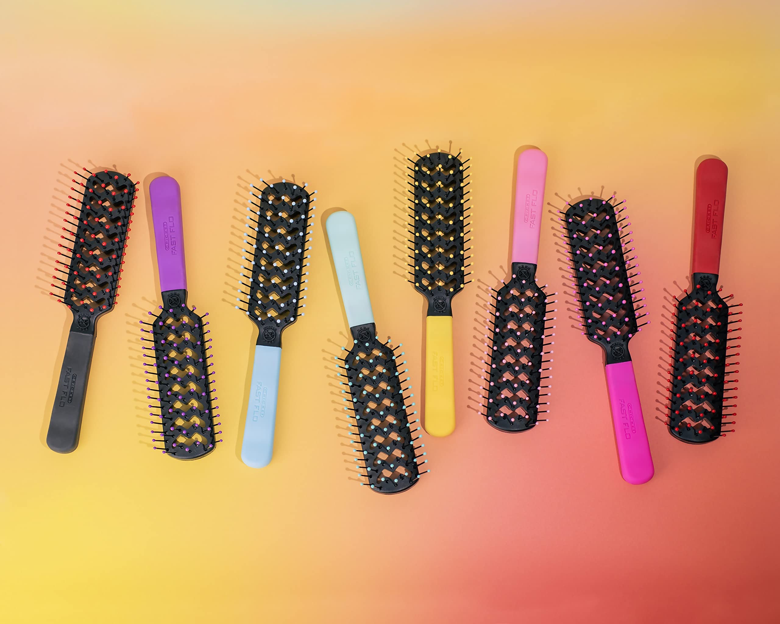 Cricket professional-at-home red brush demonstrates salon-like blowouts with detangling ease.