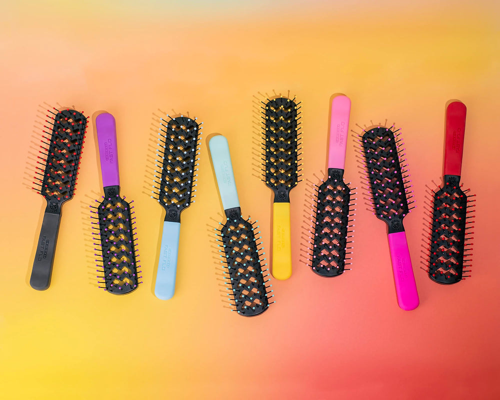 Cricket professional-at-home red brush demonstrates salon-like blowouts with detangling ease.