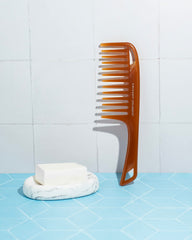 Cricket Ultra Smooth Detangler Comb with keratin protein provides anti-frizz smoothing and shine.