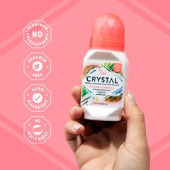 Crystal Essence Coconut Vanilla roll-on being applied shows smooth glide.