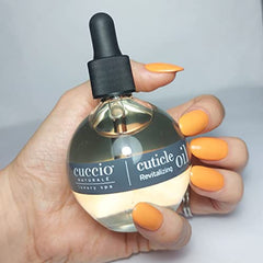 Cuccio Naturale cuticle oil being applied to cuticles for fast-absorbing moisture