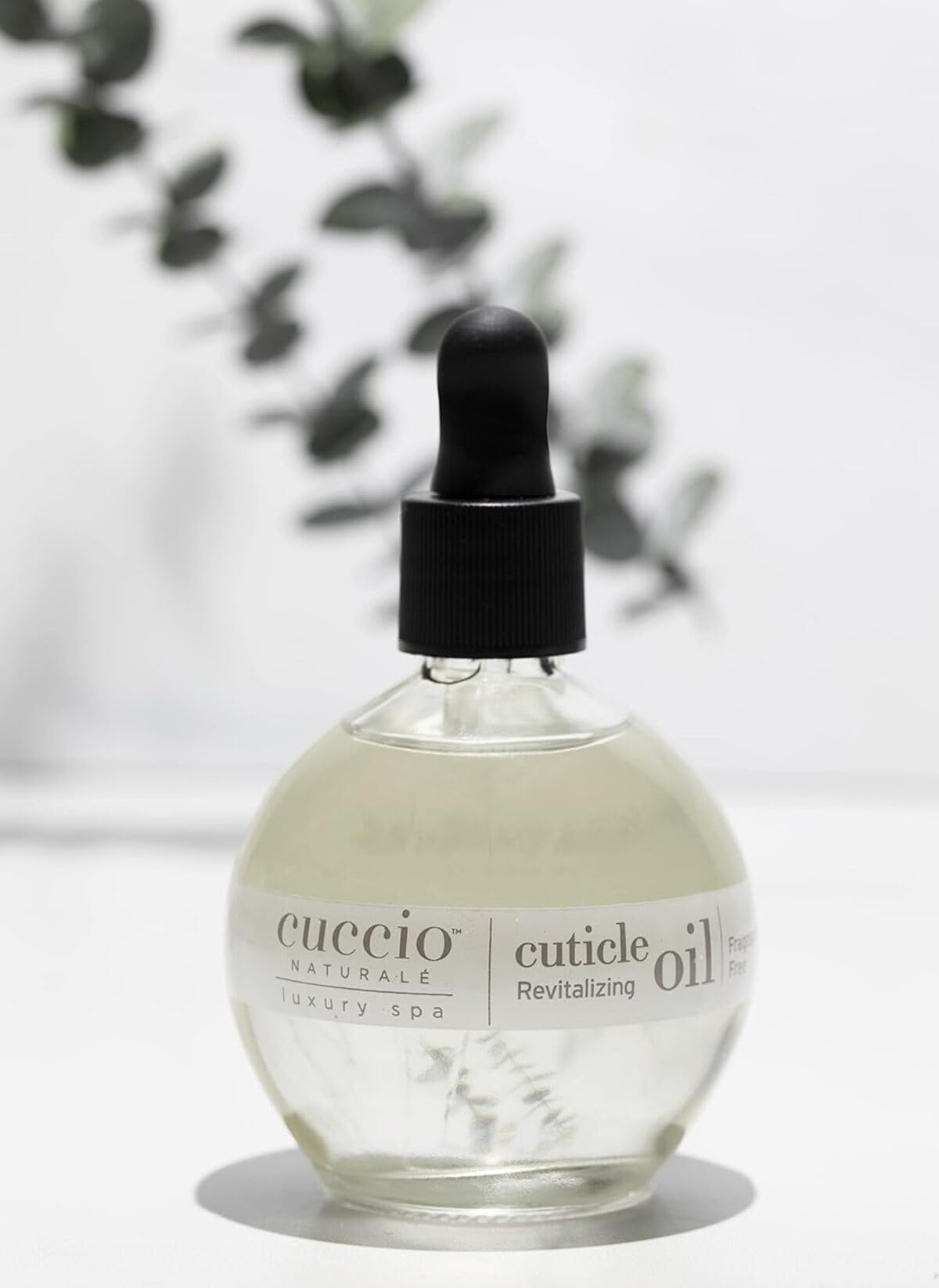 Cuccio Naturale Revitalizing Cuticle Oil on hand shows greaseless hydration and subtle shine.