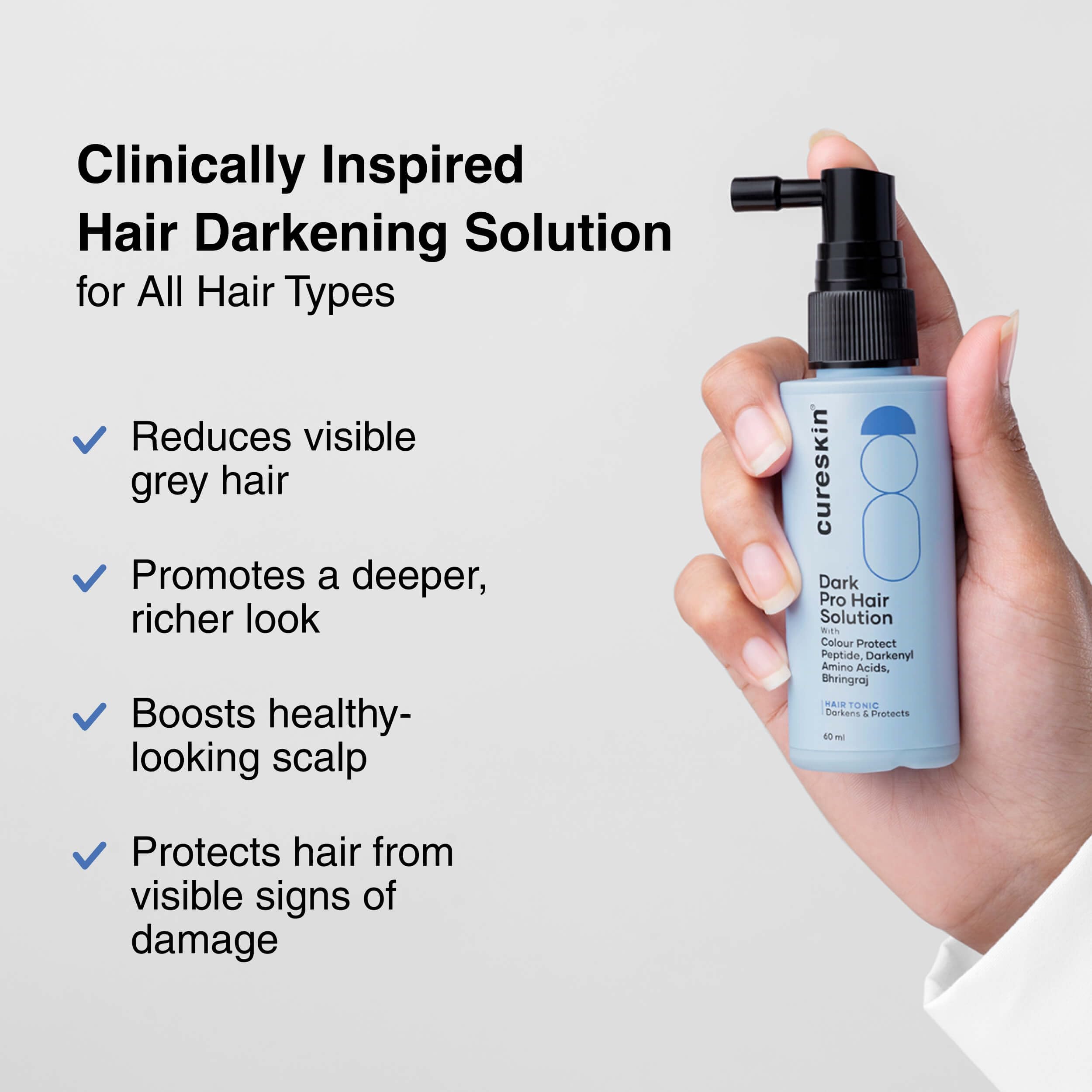 Cureskin Anti Grey Hair Serum application-hands demonstrates easy daily use for scalp nourishment.