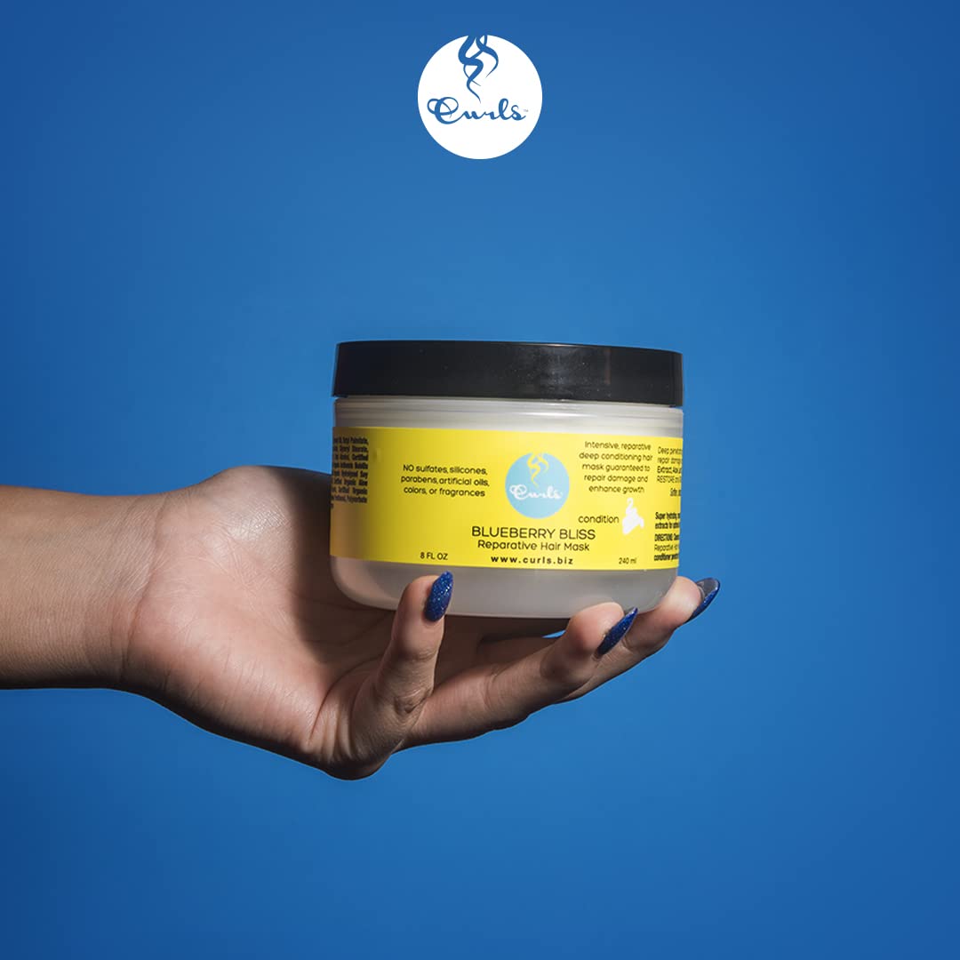 Curls Blueberry Bliss detangle with a wide-tooth comb demonstrates easier styling.