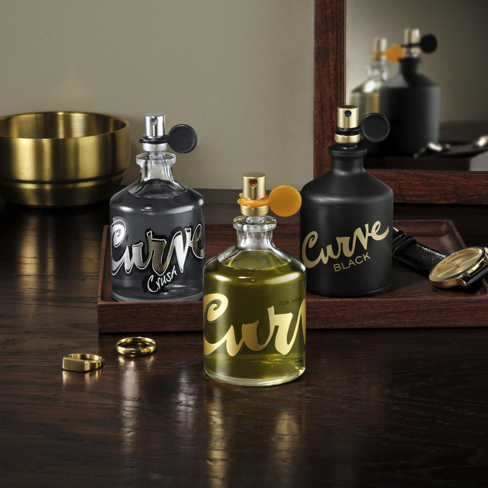 Curve Men’s Cologne bottle with amber tones highlights warm, inviting signature scent