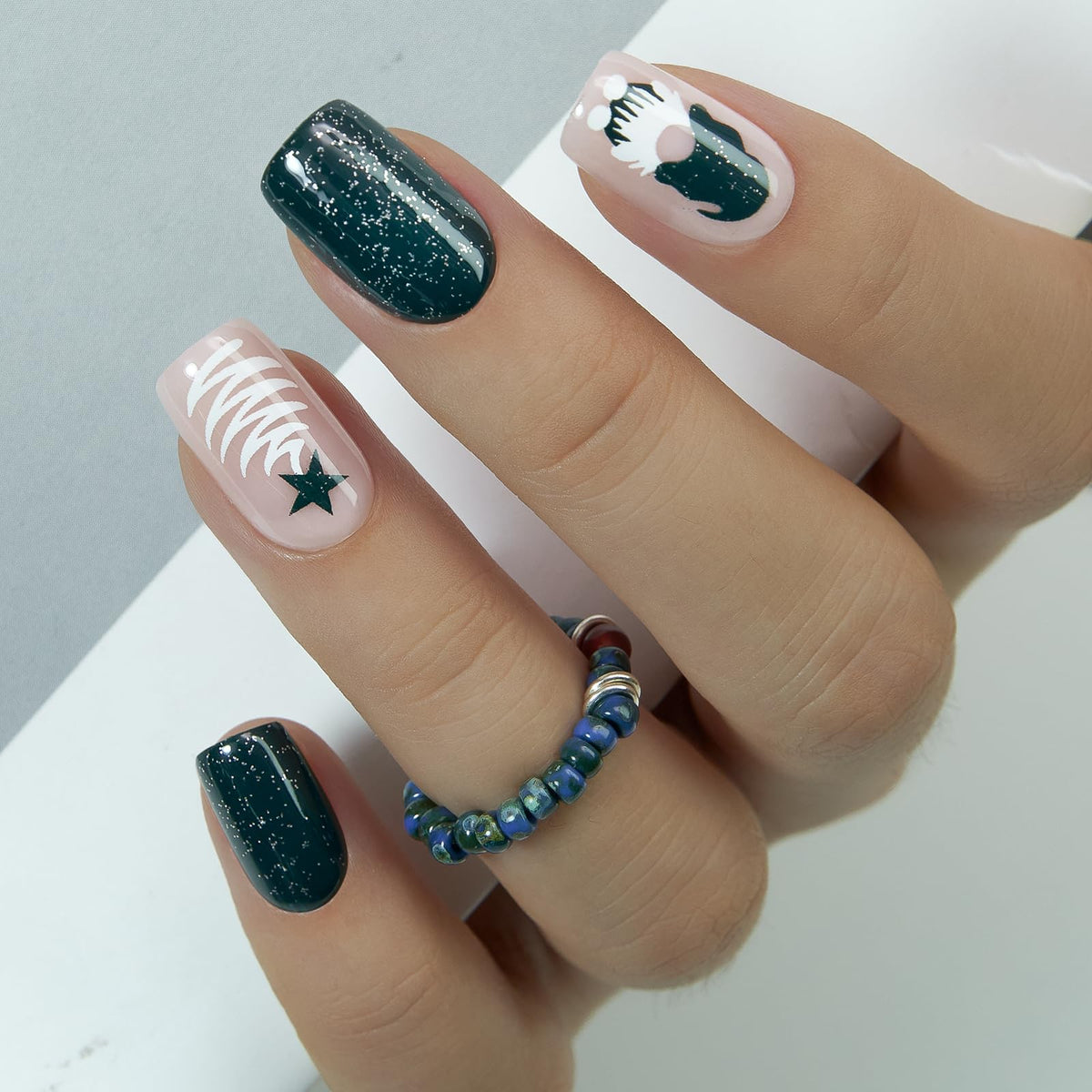 CurvLife green Christmas collection nails in closeup for holiday-ready styling.