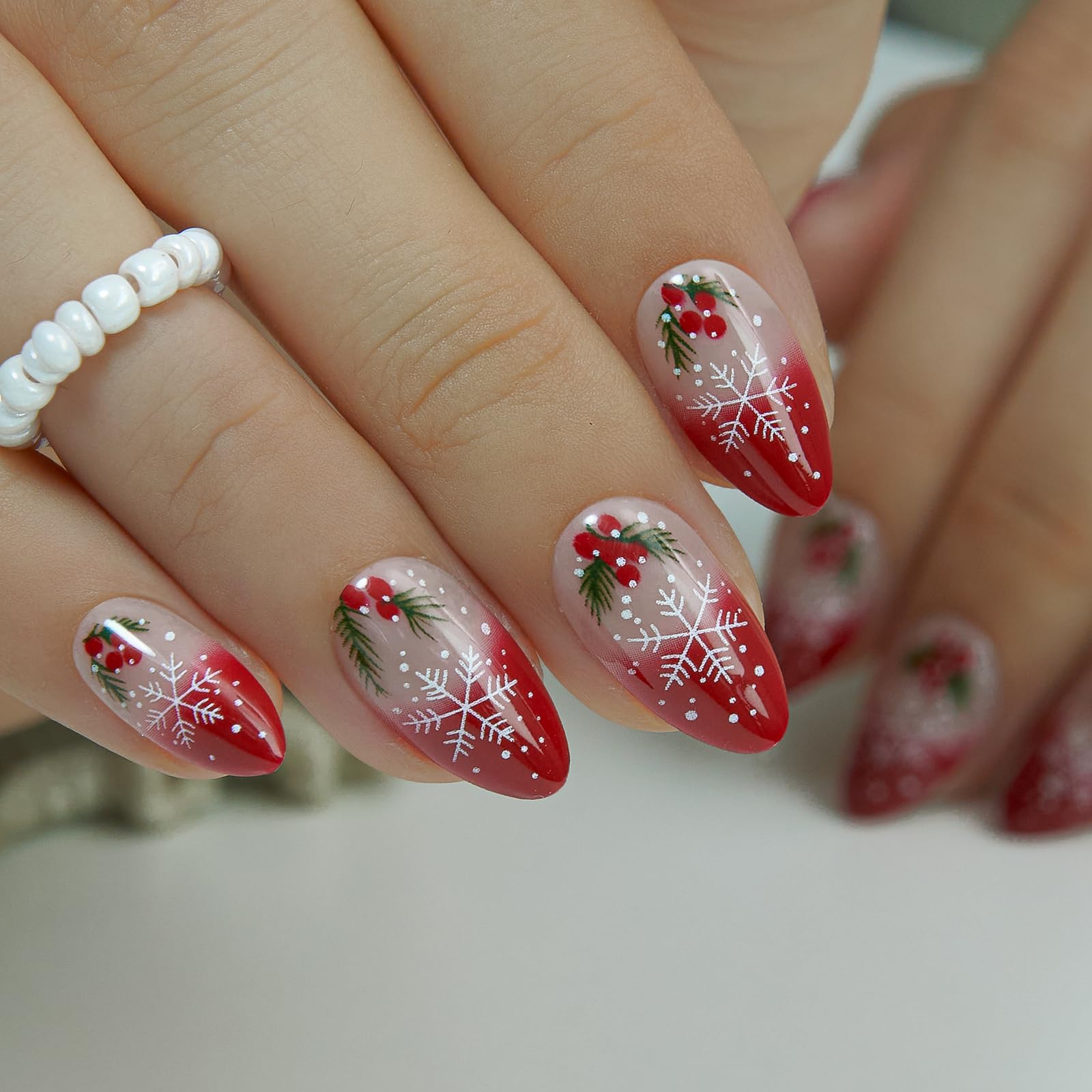 CurvLife soft gel medium press on nails in red French snowflakes for festive DIY manicure.