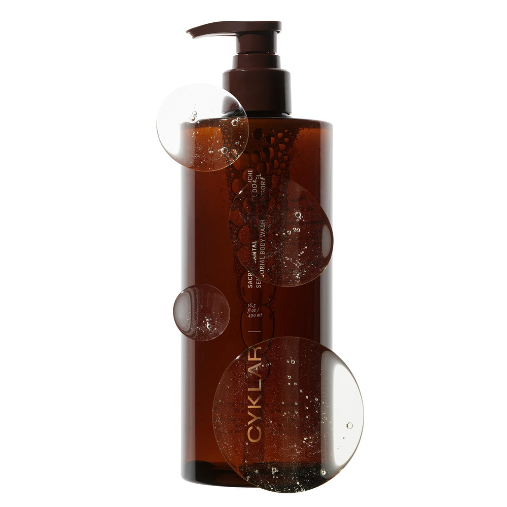CYKLAR Sensorial Body Wash Sacred Santal bottle in warm bath scene highlighting hydrating cleanse