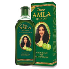 Dabur Amla Hair Oil 500ml bottle delivering long-lasting nourishment for strong, shiny hair.