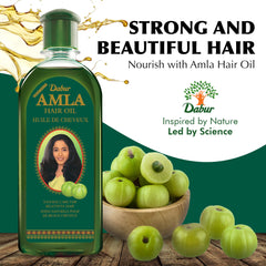 Dabur Amla Hair Oil pour demonstrates easy application and convenience