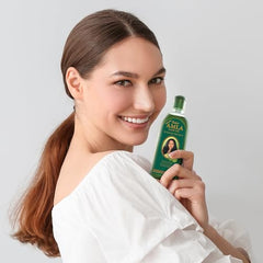 Dabur Amla Hair Oil on dull hair to add natural shine and vitality.