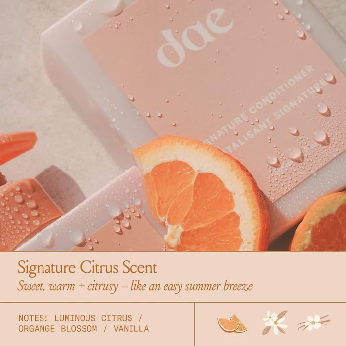 DAE Signature Conditioner application scene depicting detangling and shine