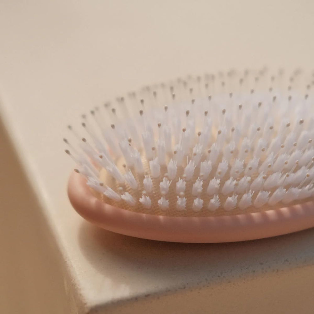 DAE Vegan Detangle + Style Brush dry-hair-use shows gentle styling for dry hair.