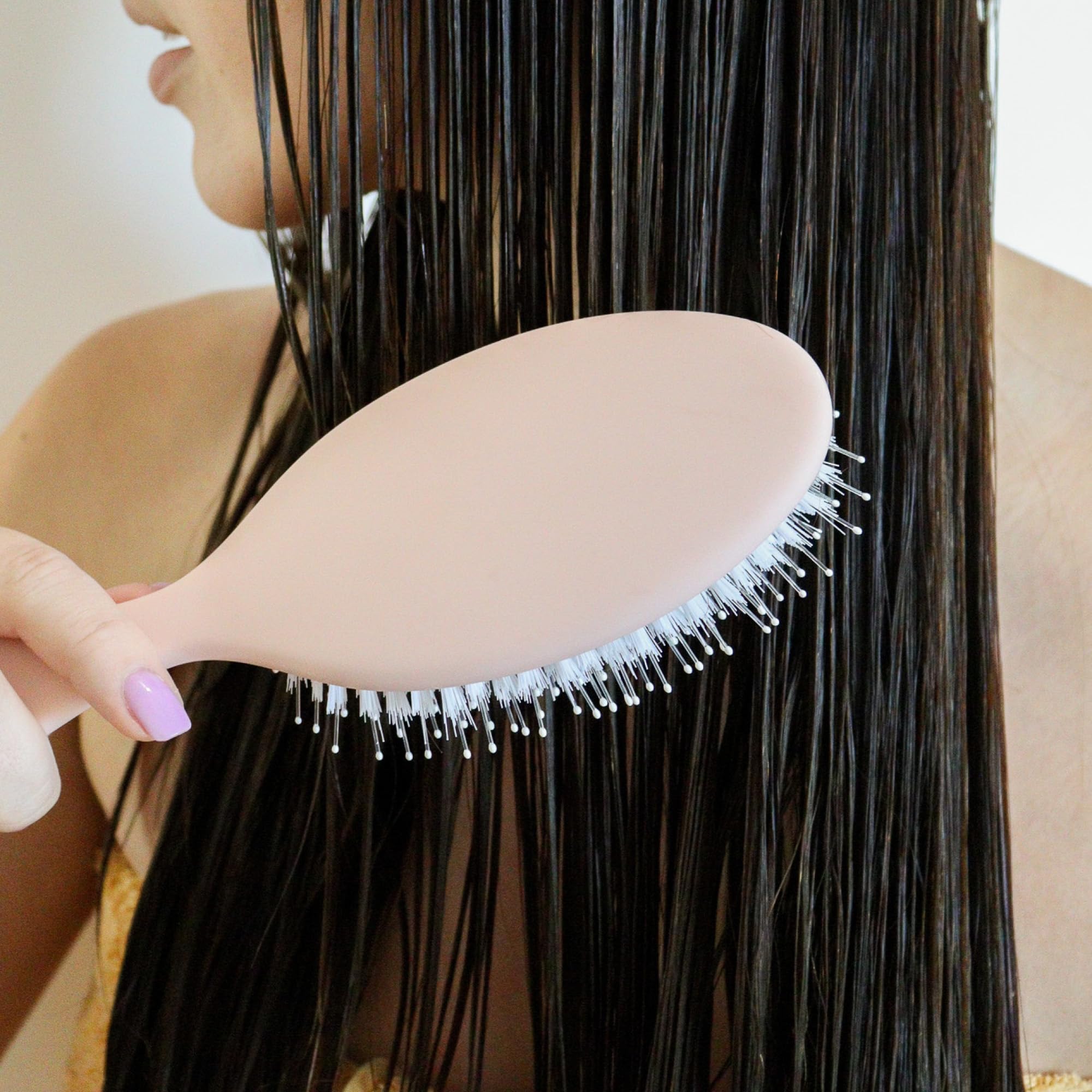 DAE Vegan Detangle + Style Brush scalp-massage closeup highlights soothing bristle massage.