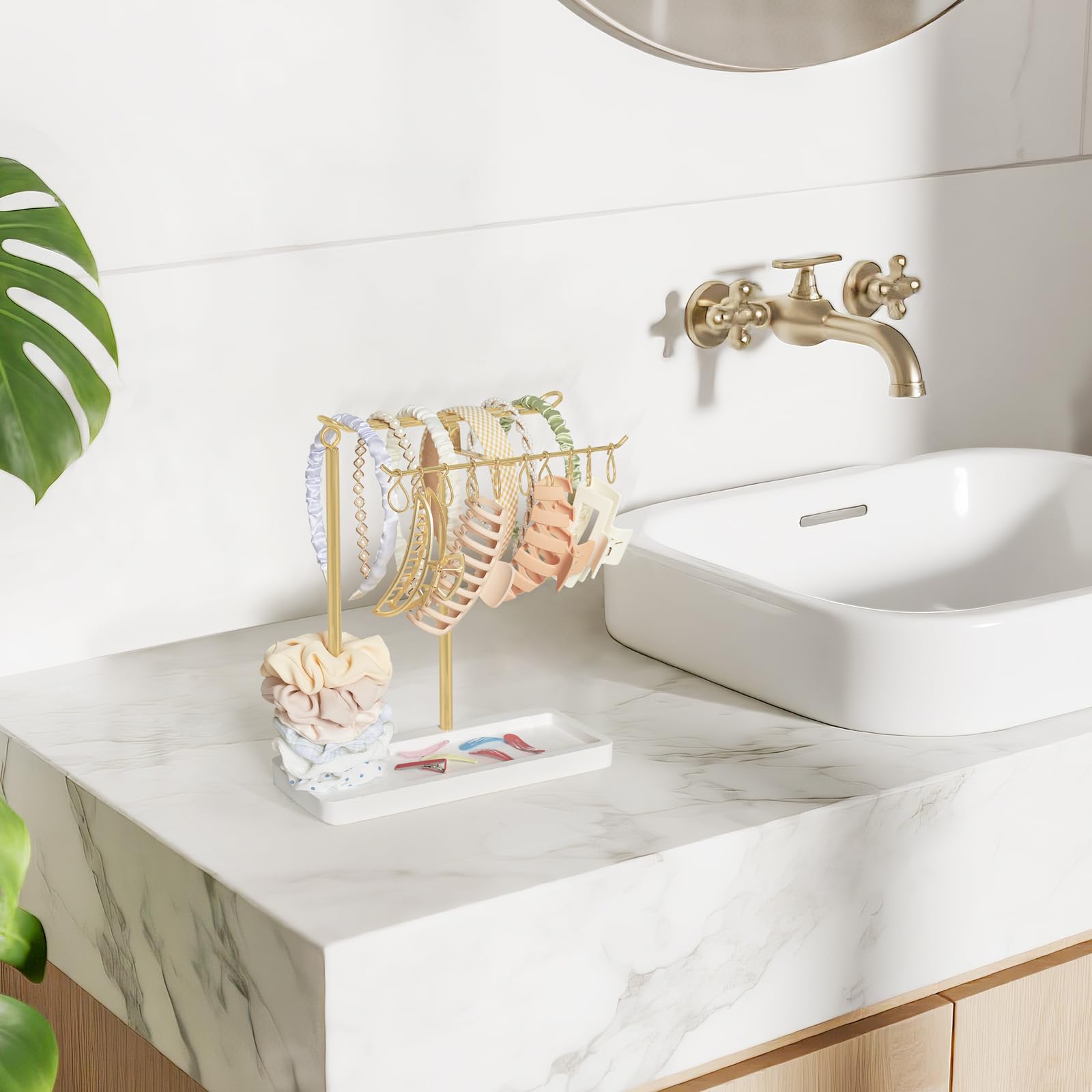 Dahey headband holder on vanity decor with scrunchies and clips in gold.