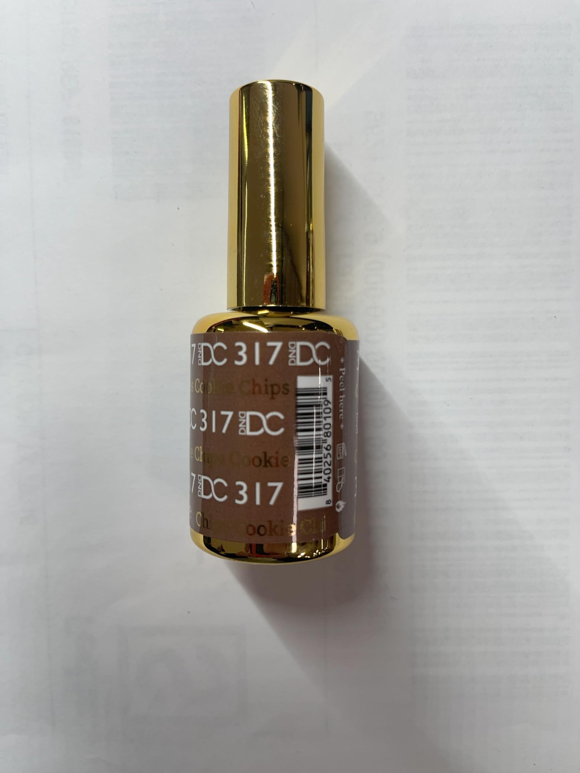 DAISY DND DC brush applicator with brown shade.