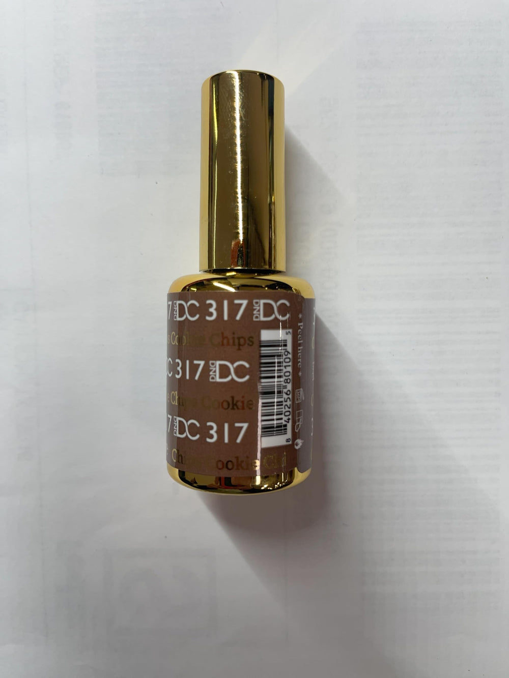 DAISY DND DC brush applicator with brown shade.