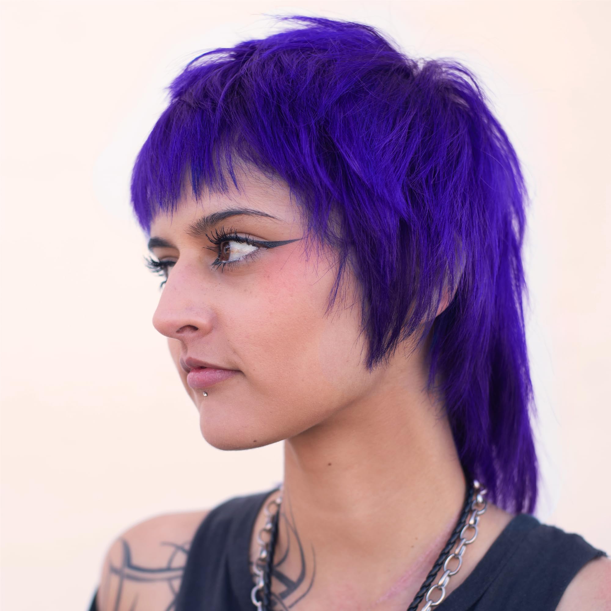 Danger Jones Libertine Violet model hair highlights even coverage across strands.