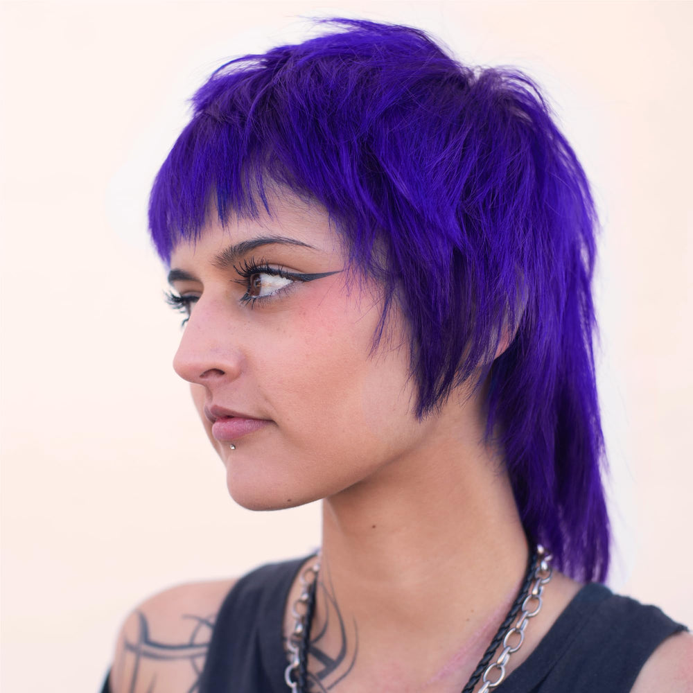 Danger Jones Libertine Violet model hair highlights even coverage across strands.