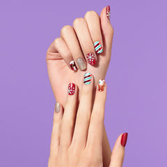 Dashing Diva Santa Helper reindeer snowflakes design showcases festive, fade-resistant nail art.