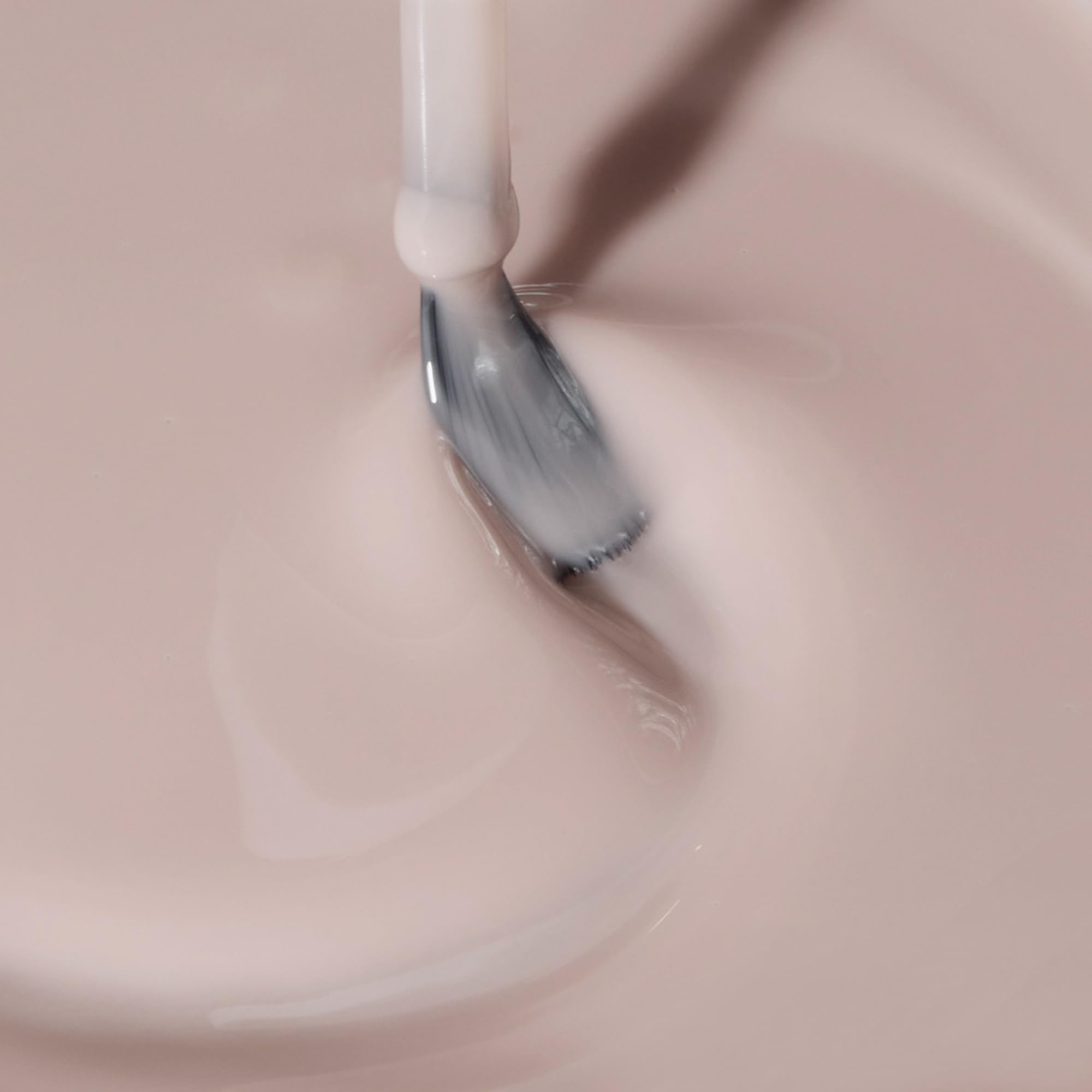 Dazzle Dry swatch shows sheer neutral tone you can layer