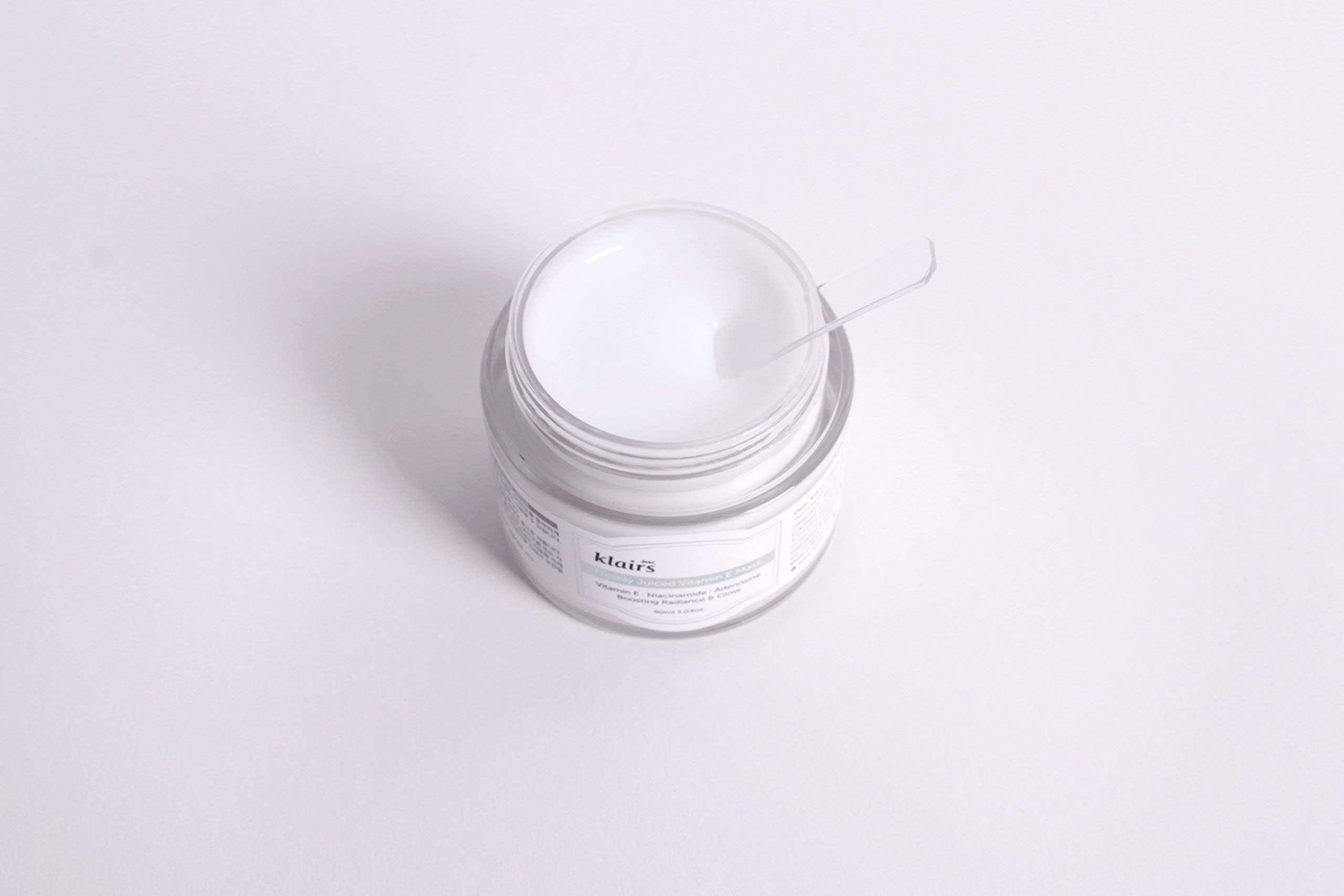 Application shot of DearKlairs mask showing dual-use as day moisturizer and overnight mask.