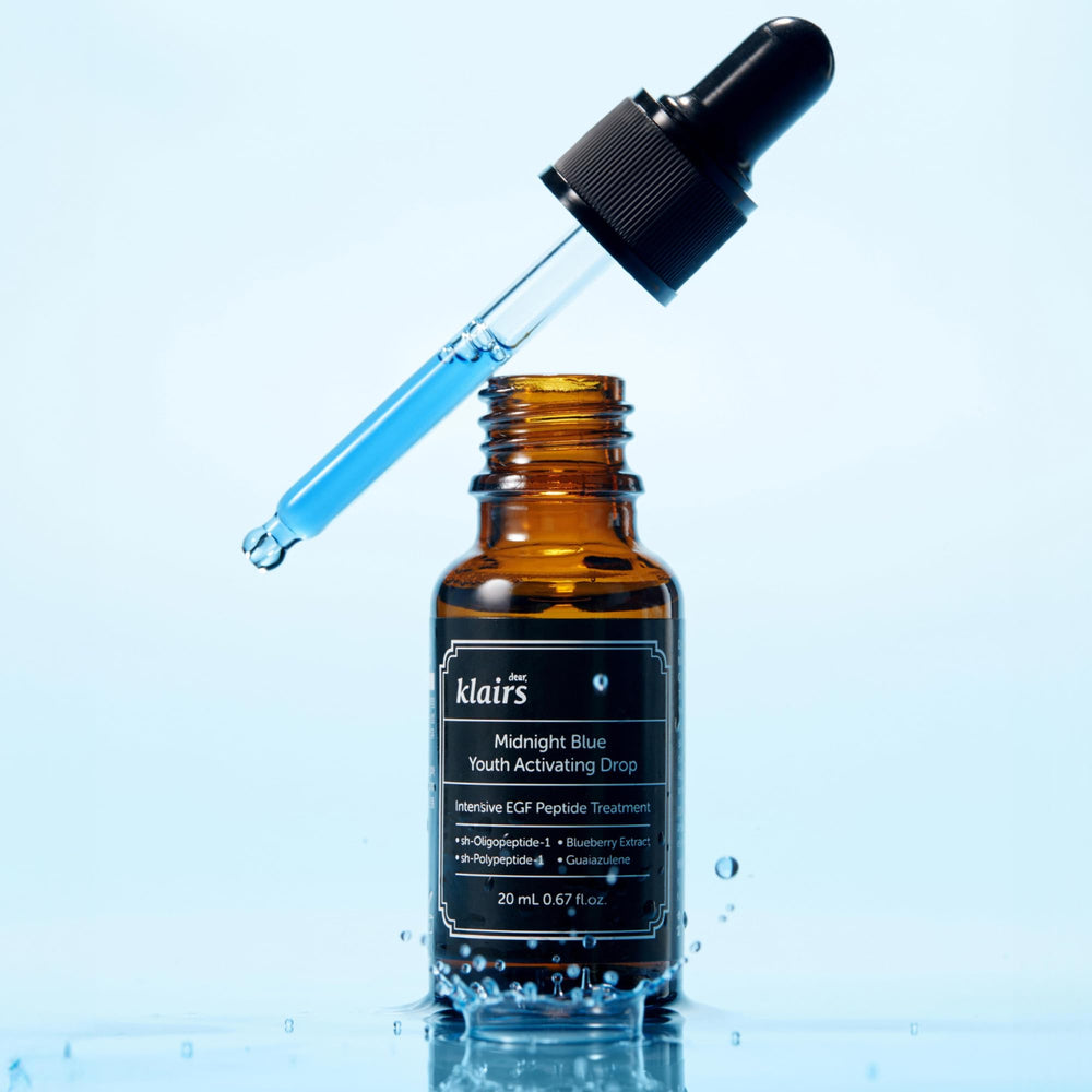 DearKlairs Midnight Blue Youth Activating Drop bottle-cap close-up — protected, travel-friendly packaging.