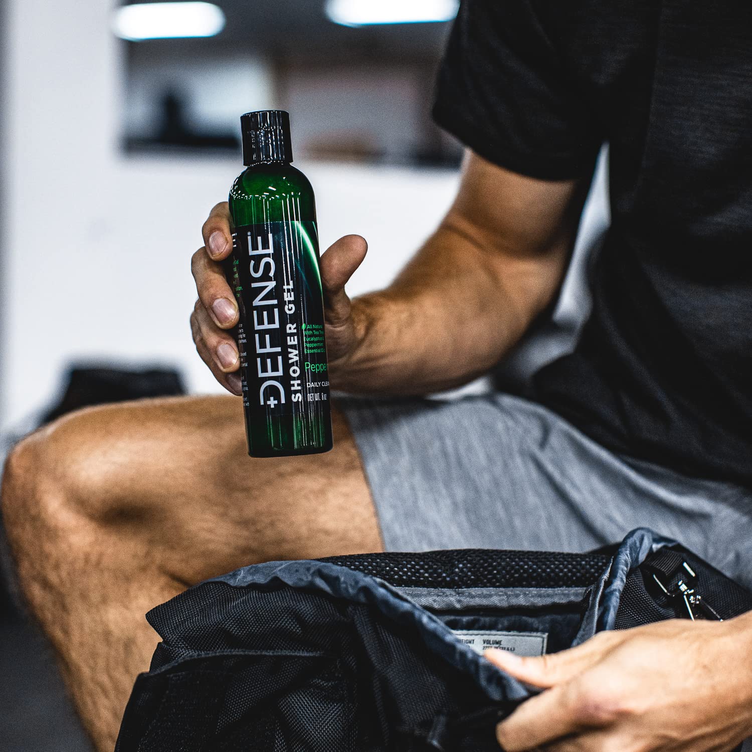 Athlete shower routine with Defense Soap after training.