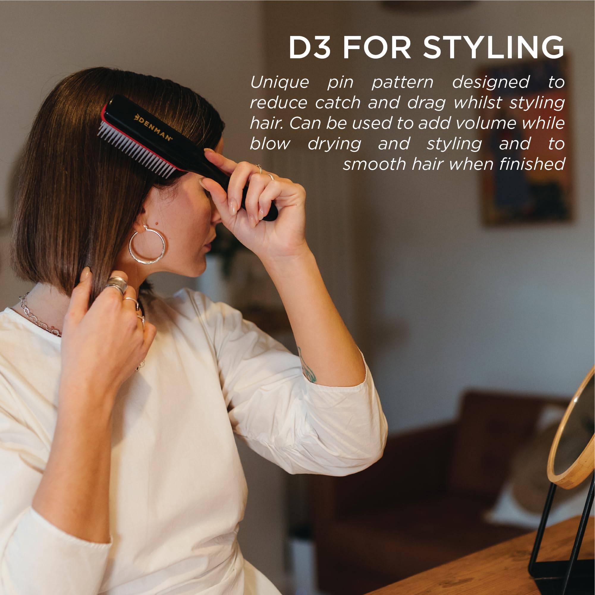 Denman D3 anti-static rubber pad close-up reducing frizz for smoother results.