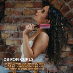Denman D3 tear-drop handle close-up for comfortable grip during long sessions.