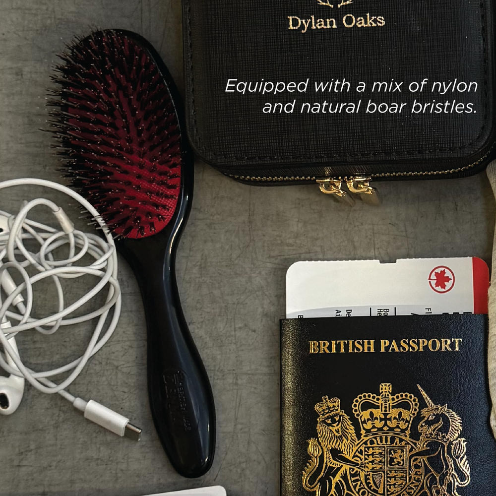 Denman cushion brush small black detangling view with flexible nylon bristles.